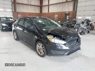 2018 Ford Focus SE z VIN 1FADP3FE8JL209560, wystawiony jako IAAI lot #42707236 z przebiegiem 166 017 mil mil oraz . Historia ofert i sprzedaży dostępna na DreamBid. Obrazek 1.