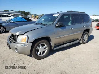 2003 GMC Envoy SLT with VIN 1GKDS13S732396407, listed as a Copart auction lot 86644884 with 152,855 mi miles and Salvage Title. Bid and sale history available at carsss.com. Image 1.