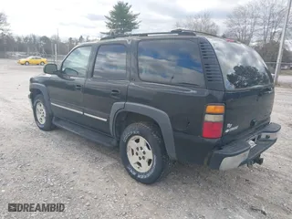 2004 Chevrolet Tahoe LT with VIN 1GNEC13Z74J314927, listed as a IAAI auction lot 41231288 with 195,809 mi miles. Bid and sale history available at carsss.com. Image 3.