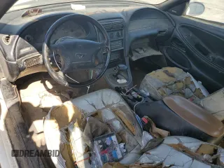 1998 Ford Mustang with VIN 1FAFP4448WF269580, listed as a Copart auction lot 54861155 with 304,869 mi miles and Salvage title. Bid and sale history available at DreamBid. Image 8.