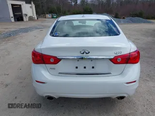 2015 Infiniti Q50 Premium z VIN JN1BV7ARXFM399617, wystawiony jako IAAI lot #41884672 z przebiegiem 116 320 mil mil oraz . Historia ofert i sprzedaży dostępna na DreamBid. Obrazek 16.
