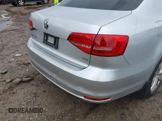 2015 Volkswagen Jetta Sedan 1.8T SE with VIN 3VWD17AJ4FM302117, listed as a IAAI auction lot 41917138 with 122,946 mi miles. Bid and sale history available at carsss.com. Image 14.