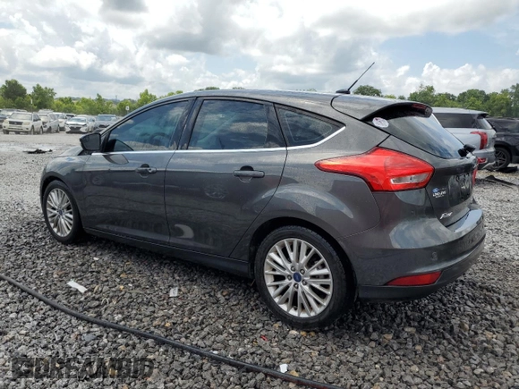 2015 Ford Focus Titanium z VIN 1FADP3N28FL239706, wystawiony jako Copart lot #62478895 z przebiegiem 143 536 mil mil oraz Szkoda całkowita • Salvage title. Historia ofert i sprzedaży dostępna na DreamBid. Obrazek 2.