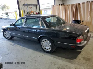 2001 Jaguar XJ with VIN SAJDA25B01MF26440, listed as a Copart auction lot 83933224 with 124,873 mi miles and Clean Title. Bid and sale history available at DreamBid. Image 2.