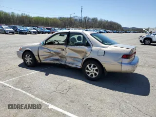 1999 Toyota Camry LE z VIN JT2BF22KXX0230830, wystawiony jako Copart lot #52253985 z przebiegiem 151 758 mil mil oraz Szkoda całkowita • Salvage title. Historia ofert i sprzedaży dostępna na DreamBid. Obrazek 2.