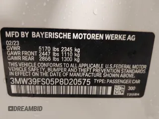 2023 BMW 3 Series 330e xDrive with VIN 3MW39FS05P8D20575, listed as a IAAI auction lot 42076033 with 10,875 mi miles. Bid and sale history available at carsss.com. Image 9.