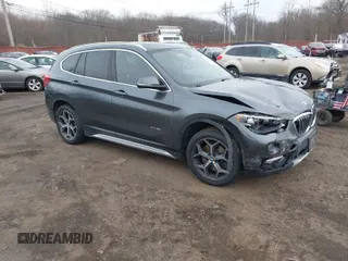 2017 BMW X1 xDrive28i with VIN WBXHT3C35H5F74213, listed as a IAAI auction lot 41589180 with 58,990 mi miles. Bid and sale history available at carsss.com. Image 1.