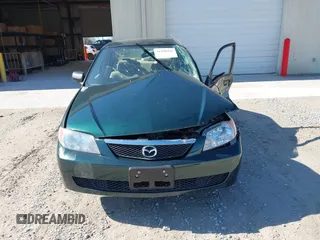 2001 Mazda Protege LX with VIN JM1BJ225310404647, listed as a IAAI auction lot 41480466 with 115,606 mi miles and . Bid and sale history available at carsss.com. Image 12.