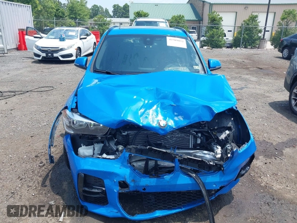 2021 BMW X1 xDrive28i with VIN WBXJG9C04M5T61811, listed as a IAAI auction lot 42509852 with 30,400 mi miles and . Bid and sale history available at DreamBid. Image 12.