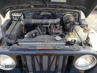 2002 Jeep Wrangler X z VIN 1J4FA39S12P759967, wystawiony jako Copart lot #57851495 z przebiegiem 178 035 mil mil oraz Szkoda całkowita • Salvage title. Historia ofert i sprzedaży dostępna na DreamBid. Obrazek 11.