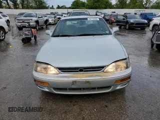 1995 Toyota Camry LE z VIN 4T1SK12E2SU617134, wystawiony jako Copart lot #54775365 z przebiegiem 305 046 mil mil oraz Szkoda całkowita • Salvage title. Historia ofert i sprzedaży dostępna na DreamBid. Obrazek 5.