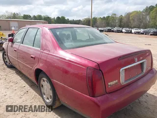 2002 Cadillac DeVille with VIN 1G6KD54Y42U137323, listed as a IAAI auction lot 41908978 with 162,926 mi miles. Bid and sale history available at carsss.com. Image 3.