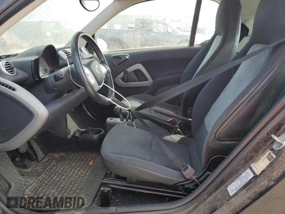 2013 Smart fortwo Pure z VIN WMEEJ3BA9DK678543, wystawiony jako Copart lot #72659984 z przebiegiem Nie podano mil oraz Czysty tytuł • Clean title. Historia ofert i sprzedaży dostępna na DreamBid. Obrazek 7.