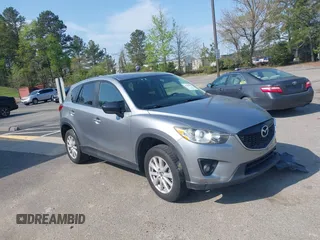 2014 Mazda CX-5 Touring with VIN JM3KE2CY9E0310315, listed as a IAAI auction lot 41943991 with 98,359 mi miles. Bid and sale history available at carsss.com. Image 1.