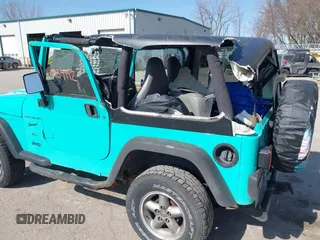 1997 Jeep Wrangler Sport with VIN 1J4FY19S2VP423426, listed as a IAAI auction lot 41734992 with 164,706 mi miles. Bid and sale history available at carsss.com. Image 6.