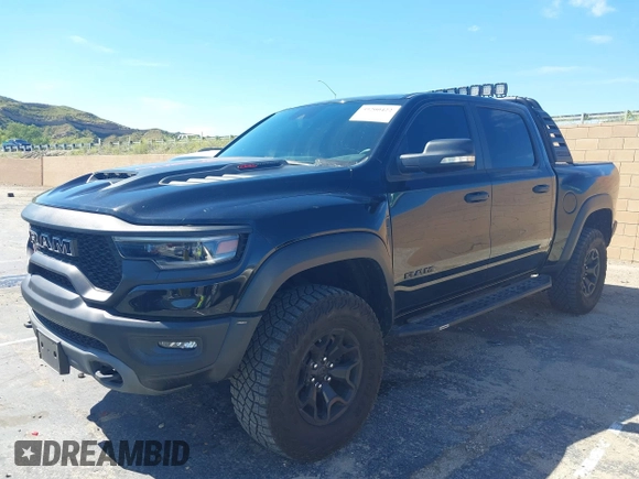 2022 Ram 1500 TRX with VIN 1C6SRFU95NN346475, listed as a IAAI auction lot 39200422 with 14,919 mi miles and . Bid and sale history available at DreamBid. Image 2.