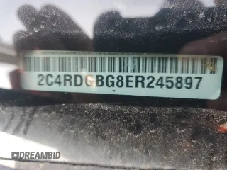 2014 Dodge Grand Caravan American Value with VIN 2C4RDGBG8ER245897, listed as a Copart auction lot 54066945 with 144,177 mi miles and Clean Title. Bid and sale history available at DreamBid. Image 13.