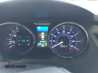 2015 Hyundai Sonata Hybrid Limited with VIN KMHEC4A49FA133103, listed as a IAAI auction lot 41885524 with 122,261 mi miles. Bid and sale history available at carsss.com. Image 7.