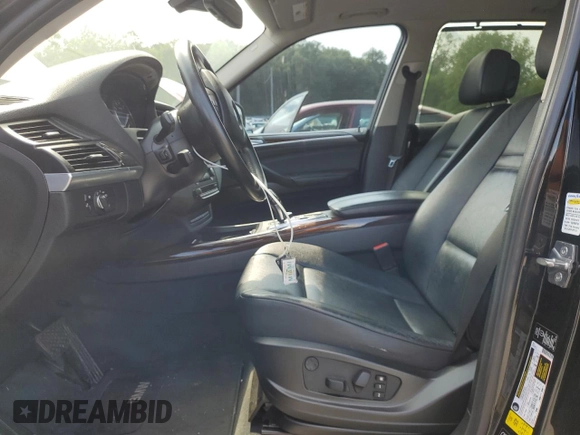 2012 BMW X5 35i with VIN 5UXZV4C59CL752661, listed as a Copart auction lot 58590305 with 101,725 mi miles and Salvage title. Bid and sale history available at DreamBid. Image 7.