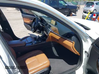 2013 BMW 3 Series 328i xDrive with VIN WBA3B5C51DJ599144, listed as a IAAI auction lot 42059260 with 84,153 mi miles. Bid and sale history available at carsss.com. Image 5.
