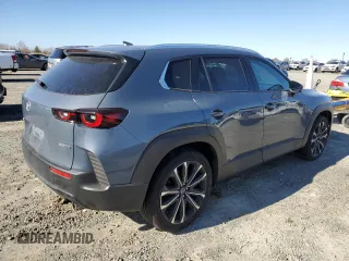 2023 Mazda CX-50 S Premium Plus z VIN 7MMVABEM2PN107512, wystawiony jako Copart lot #38534253 z przebiegiem 9 591 mil mil oraz . Historia ofert i sprzedaży dostępna na DreamBid. Obrazek 3.
