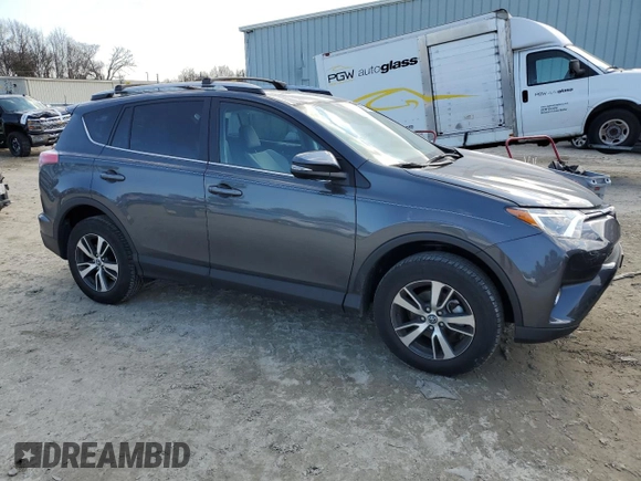 2018 Toyota RAV4 XLE with VIN 2T3RFREV3JW848384, listed as a Copart auction lot 88758945 with 28,951 mi miles and Salvage Title. Bid and sale history available at DreamBid. Image 4.