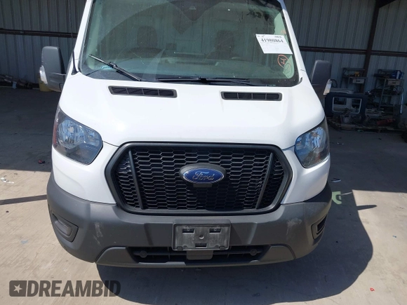 2022 Ford Transit Cargo with VIN 1FTBW3X89NKA69141, listed as a IAAI auction lot 41980864 with 102,721 mi miles and . Bid and sale history available at DreamBid. Image 6.