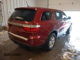 2013 Dodge Durango SXT with VIN 1C4RDJAG4DC527945, listed as a IAAI auction lot 41590545 with 141,074 mi miles and . Bid and sale history available at DreamBid. Image 4.