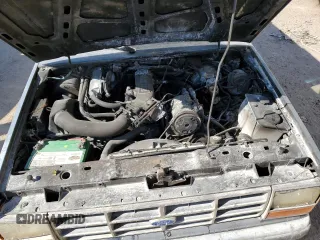 1990 Ford Bronco z VIN 1FMCU12T2LUA31399, wystawiony jako Copart lot #77099614 z przebiegiem 85 663 mil mil oraz Szkoda całkowita • Salvage title. Historia ofert i sprzedaży dostępna na DreamBid. Obrazek 11.