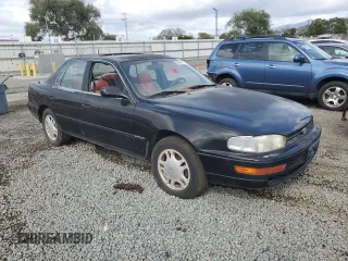 1994 Toyota Camry XLE with VIN JT2GK13E0R0012242, listed as a Copart auction lot 50966775 with 70,922 mi miles and Salvage Title. Bid and sale history available at carsss.com. Image 4.