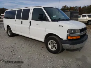 2014 Chevrolet Express Passenger LT with VIN 1GAZG1FG2E1202457, listed as a Copart auction lot 82704884 with 142,982 mi miles and Salvage title. Bid and sale history available at DreamBid. Image 4.