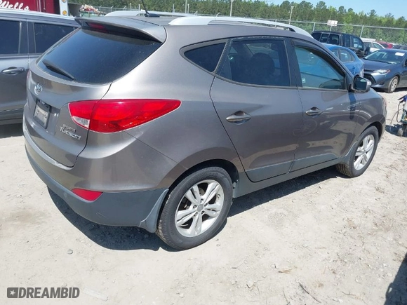 2013 Hyundai Tucson GLS with VIN KM8JU3AC0DU557505, listed as a IAAI auction lot 42017594 with 159,551 mi miles. Bid and sale history available at carsss.com. Image 4.