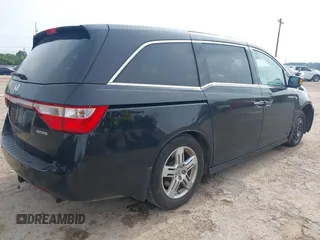 2011 Honda Odyssey Touring with VIN 5FNRL5H90BB070472, listed as a IAAI auction lot 42367710 with 203,589 mi miles and . Bid and sale history available at DreamBid. Image 4.