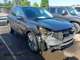 2020 Ford Escape Titanium Hybrid z VIN 1FMCU9DZ6LUB12874, wystawiony jako IAAI lot #42159222 z przebiegiem 63 862 mil mil oraz . Historia ofert i sprzedaży dostępna na DreamBid. Obrazek 1.