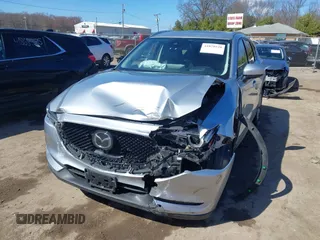 2021 Mazda CX-5 Grand Touring with VIN JM3KFBDM3M1300316, listed as a IAAI auction lot 41878520 with 77,670 mi miles and . Bid and sale history available at DreamBid. Image 17.