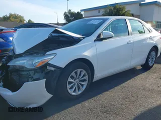 2015 Toyota Camry XLE with VIN 4T1BF1FK9FU923208, listed as a IAAI auction lot 42076970 with 124,096 mi miles and . Bid and sale history available at carsss.com. Image 2.