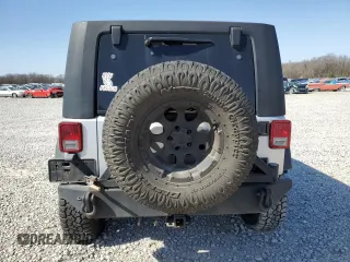 2010 Jeep Wrangler Unlimited Rubicon with VIN 1J4BA6H12AL107485, listed as a Copart auction lot 48802825 with 123,299 mi miles and Salvage title. Bid and sale history available at DreamBid. Image 6.