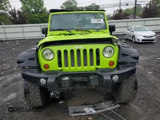 2012 Jeep Wrangler Sport with VIN 1C4AJWAG2CL233722, listed as a Copart auction lot 61125095 with 49,864 mi miles and Salvage title. Bid and sale history available at DreamBid. Image 5.