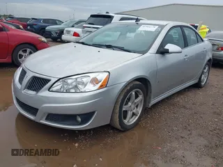 2009 Pontiac G6 1SB with VIN 1G2ZJ57K094243360, listed as a IAAI auction lot 41904278 with 144,346 mi miles and . Bid and sale history available at DreamBid. Image 2.