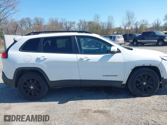 2014 Jeep Cherokee Latitude with VIN 1C4PJMCS9EW309289, listed as a IAAI auction lot 42003252 with 99,360 mi miles and . Bid and sale history available at DreamBid. Image 13.