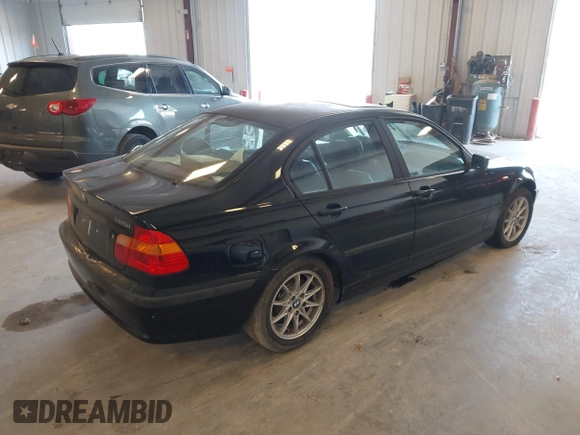 2004 BMW 3 Series 325i with VIN WBAEV334X4KL63050, listed as a IAAI auction lot 42117698 with 173,687 mi miles. Bid and sale history available at carsss.com. Image 4.
