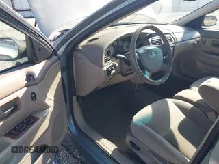 2005 Ford Taurus SEL z VIN 1FAFP56205A232164, wystawiony jako IAAI lot #42201770 z przebiegiem 115 406 mil mil oraz . Historia ofert i sprzedaży dostępna na DreamBid. Obrazek 16.