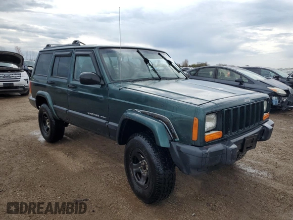 2000 Jeep Cherokee with VIN 1J4FF48S3YL149593, listed as a Copart auction lot 52489045 with 290,231 mi miles and Salvage title. Bid and sale history available at DreamBid. Image 4.