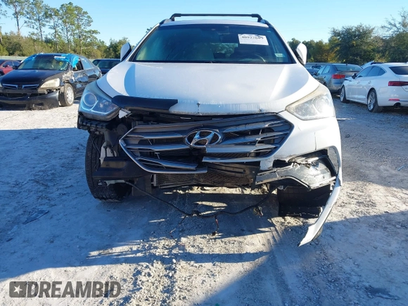 2017 Hyundai Santa Fe 2.4L z VIN 5XYZU3LB4HG435992, wystawiony jako IAAI lot #40927607 z przebiegiem 104 868 mil mil oraz . Historia ofert i sprzedaży dostępna na DreamBid. Obrazek 6.