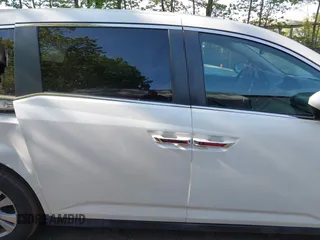 2014 Honda Odyssey EX-L with VIN 5FNRL5H63EB064854, listed as a IAAI auction lot 42102704 with 148,536 mi miles and . Bid and sale history available at carsss.com. Image 13.