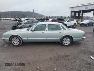 1998 Jaguar XJ with VIN SAJHN1242WC819689, listed as a IAAI auction lot 41148530 with 60,143 mi miles and . Bid and sale history available at DreamBid. Image 14.