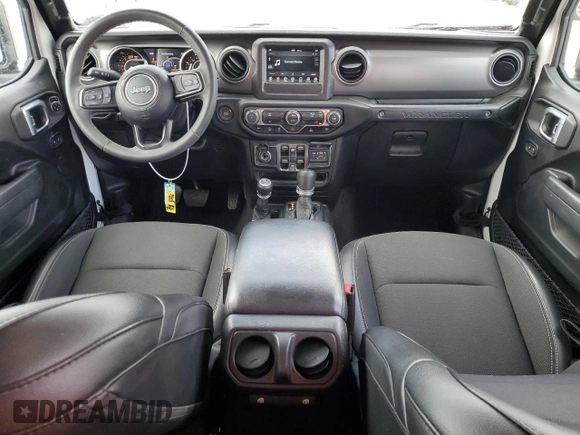 2023 Jeep Wrangler Sport S with VIN 1C4HJXDNXPW569699, listed as a Copart auction lot 52392145 with 32,972 mi miles and Salvage title. Bid and sale history available at DreamBid. Image 8.