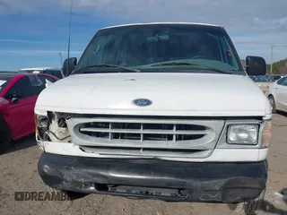 2002 Ford Econoline Cargo with VIN 1FTRE14252HB67887, listed as a IAAI auction lot 41180872 with 274,561 mi miles and . Bid and sale history available at carsss.com. Image 12.