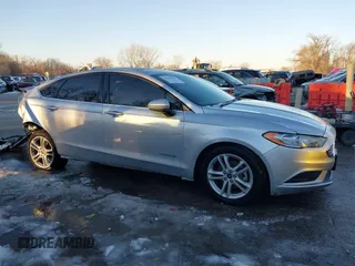 2018 Ford Fusion SE z VIN 3FA6P0LU4JR269064, wystawiony jako IAAI lot #41222967 z przebiegiem 115 077 mil mil oraz . Historia ofert i sprzedaży dostępna na DreamBid. Obrazek 14.