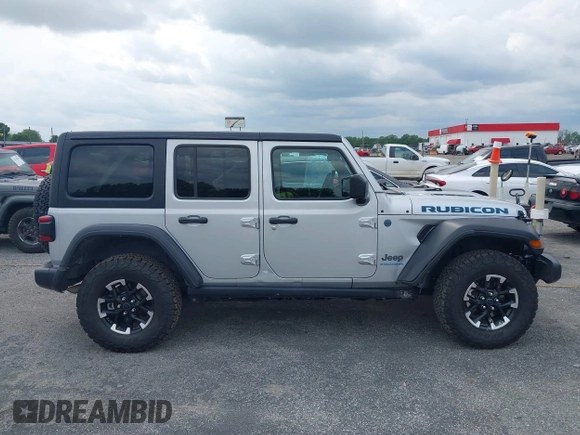 2024 Jeep Wrangler Rubicon with VIN 1C4RJXR61RW224506, listed as a IAAI auction lot 42111434 with 33,689 mi miles and . Bid and sale history available at DreamBid. Image 13.
